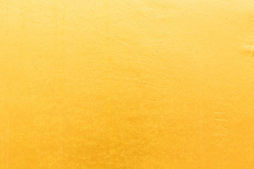Gold concrete wall on background texture.