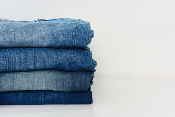 Fototapeta na wymiar stack of jeans isolated on white