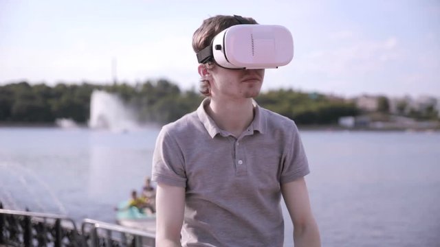 Young man in 360 VR glasses. Virtual reality glasses. 1080p.