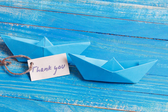 Label with the Words Thank you. Paper Boat with a sign