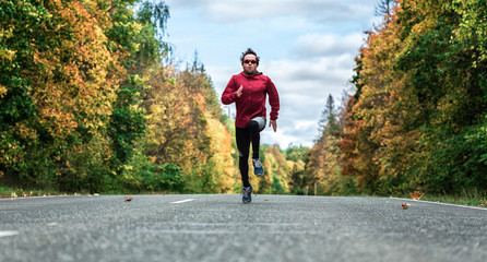 Fototapeta premium Man runs on the road