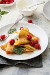 crepes with cream and raspberries