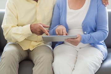 Senior couple using a tablet