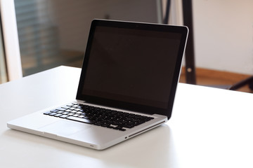 modern laptop on a white desk
