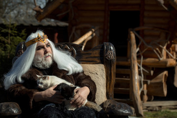 Old druid sits in chair