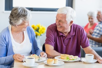Senior couple having lunch together - Powered by Adobe