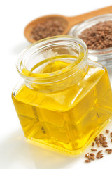 linseed oil in bottle isolated on white