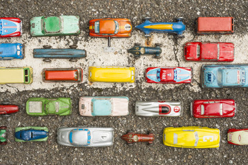 Collection of antique toy cars on asphalt background - 114975849