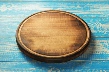 pizza cutting board at rustic background