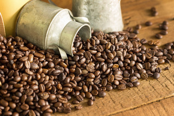 Roasted coffee beans on a wood floor