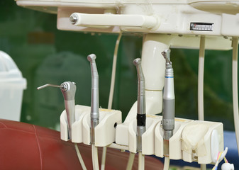 Dental equipment on arm of dental unit