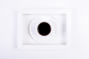 Coffee cup inside picture frame