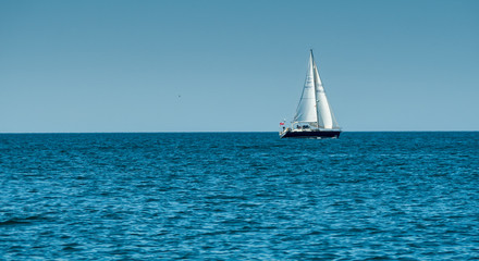 A view of the sailing boat near the Algarve coast in Portugal, 2016