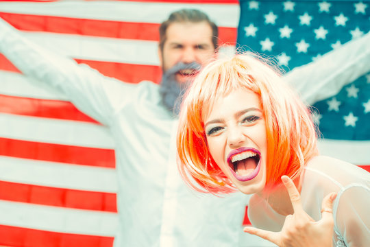 Happy young patriotic Americans bright make up and hair celebrating Independence Day on 4th of July - Powered by Adobe