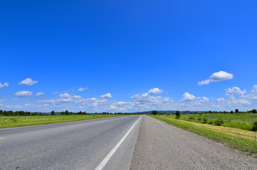 Straight empty road running to horizon