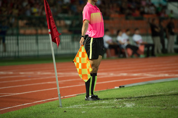 Assistant football referee and Referee's flag signal corner kick