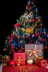 illuminated christmas tree with gifts and presents