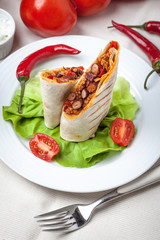 Burritos filled wiht minced meat, bean and vegetables.