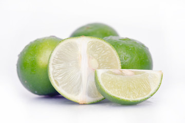 Lemon or lime fruit with half cross section and partial section