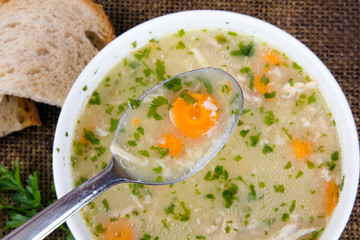 traditional barley soup with meat in a white bowl