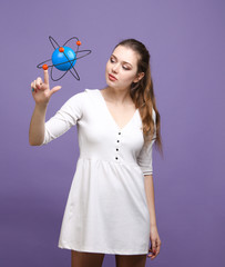 Woman scientist with atom model, research concept