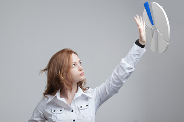 Woman shows a pie chart, circle diagram. Business analytics concept.