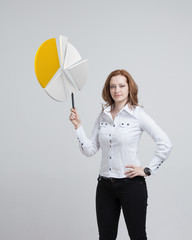 Woman shows a pie chart, circle diagram. Business analytics concept.