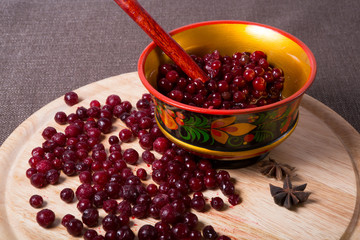 Frozen crannberries on wooden board
