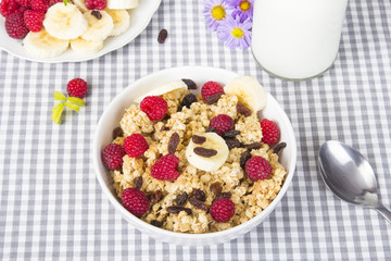 granola with fruits and bottle of fresh milk
