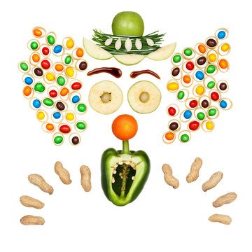 Scary fruity clown / Funny clown made of vegetables and fruits in a kids menu isolated on white.