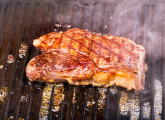 beef steak on a grill