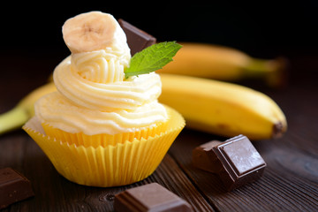 Banana cupcakes on black background