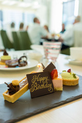 Different cakes on stylish plate
