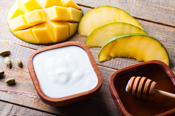 Ingredients for preparation the Indian specialty mango lassi.