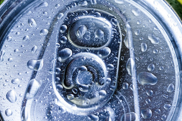 Top part of beer cans with water drops.Close up view