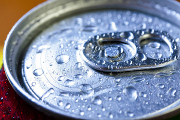 Top part of beer cans with water drops.Close up view