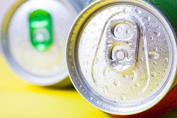 Top part of beer cans with water drops.Close up view