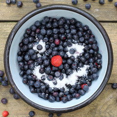berry face in a good mood/ emotional dish of fresh berries top view of a smiling 