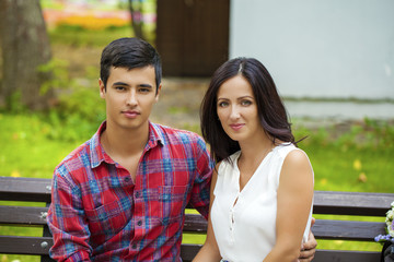 Beautiful young loving couple standing outdoors