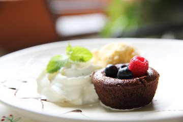 Chocolate lava cake and berries with ice cream