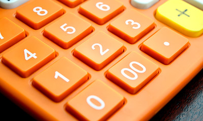 Close up of number button on orange calculator, Color Filtered Photo - 114990442