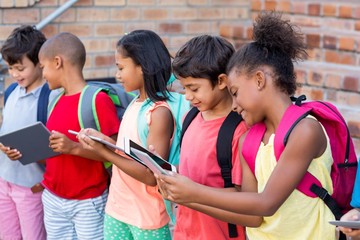 Students using digital tablets