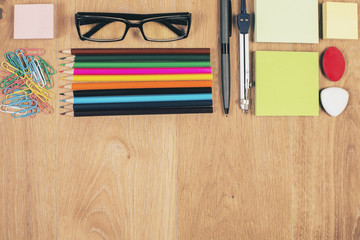 Desktop with stationery and glasses