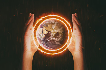 Human Hands Burning The World - Global Warming Effect . Environment concept. World Environment Day...