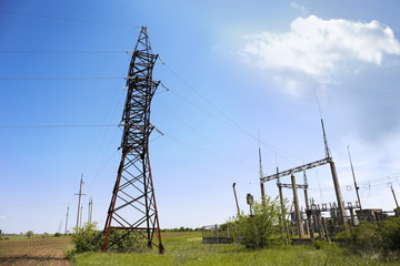 High voltage tower on blue sky background
