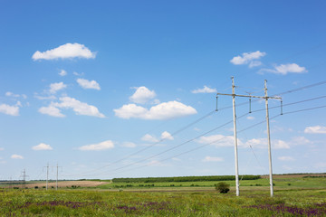 Fototapeta na wymiar High voltage tower in field