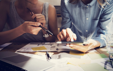 Woman Touching Display Digital Tablet Hand.Project Manager Researching Process.Business Team Working Startup modern Coworking.Analyze market stock.Using electronic device,paper,note wood table Blurred