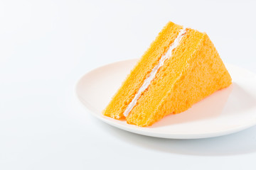 Orange chiffon cake on white background