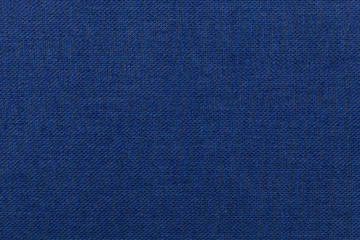 Dark blue background from textile material. Fabric with natural texture.