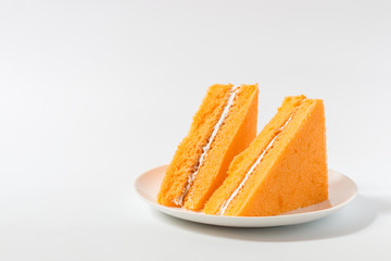 Orange chiffon cake on white background